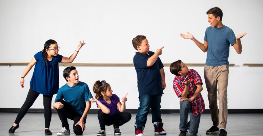 A group of children in a drama class